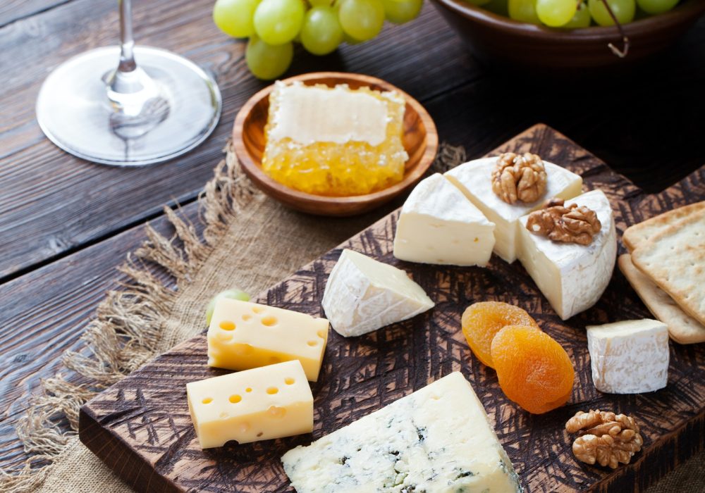 red-wine-in-glass-with-cheese-honey-nuts-and-grape-.jpg